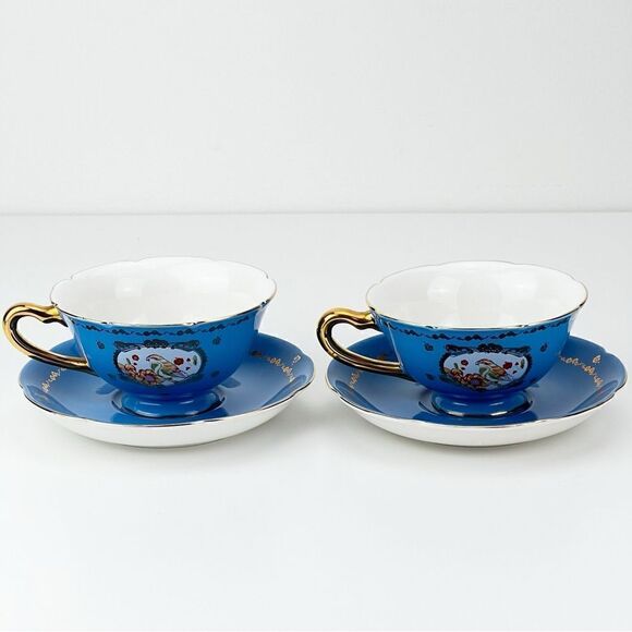 2 x Anthropologie Porcelain Teacup & Saucer Gold Blue Bird Parrot Floral… - Picture 1 of 8